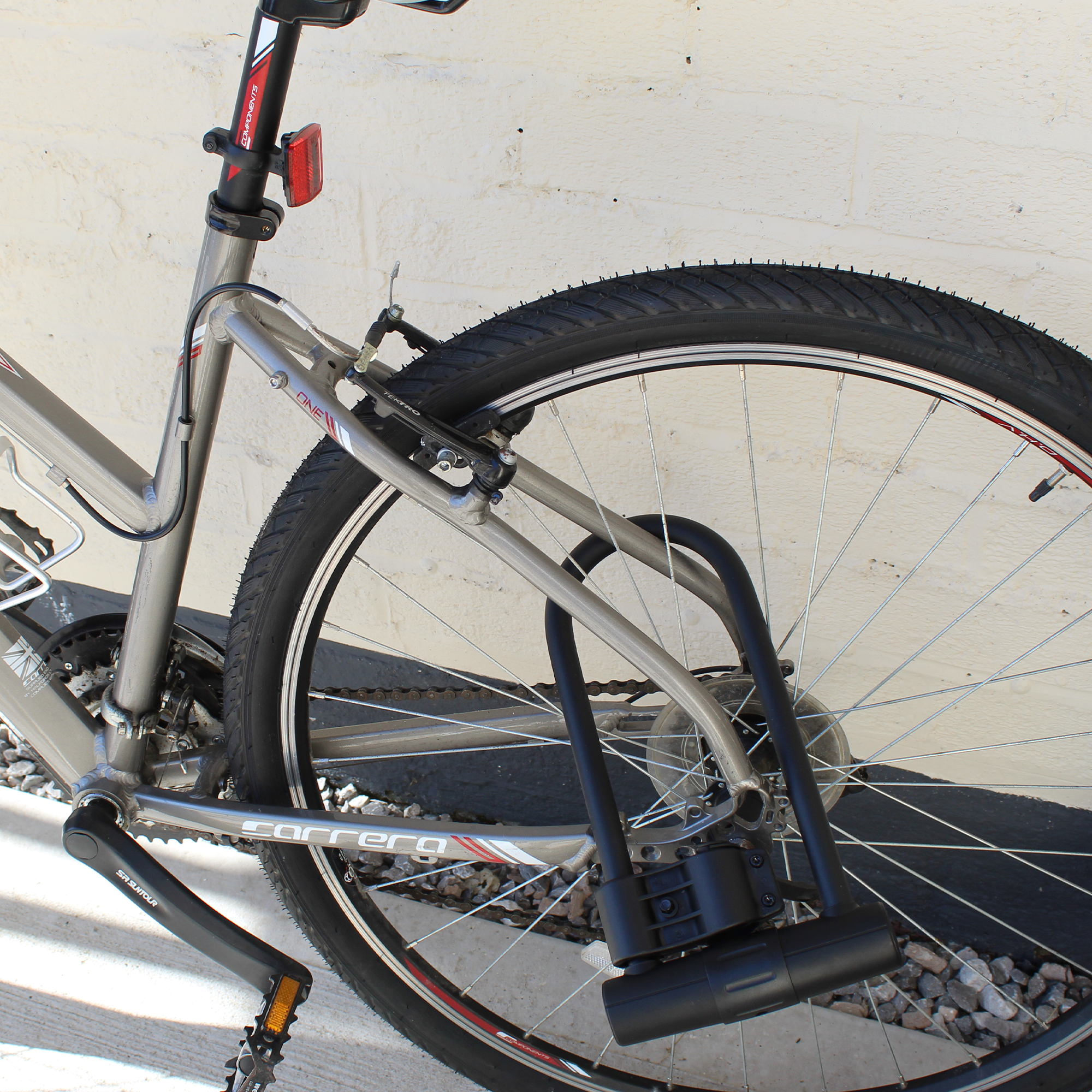 Secure bike lock with reflective cover for increased visibility outdoors
