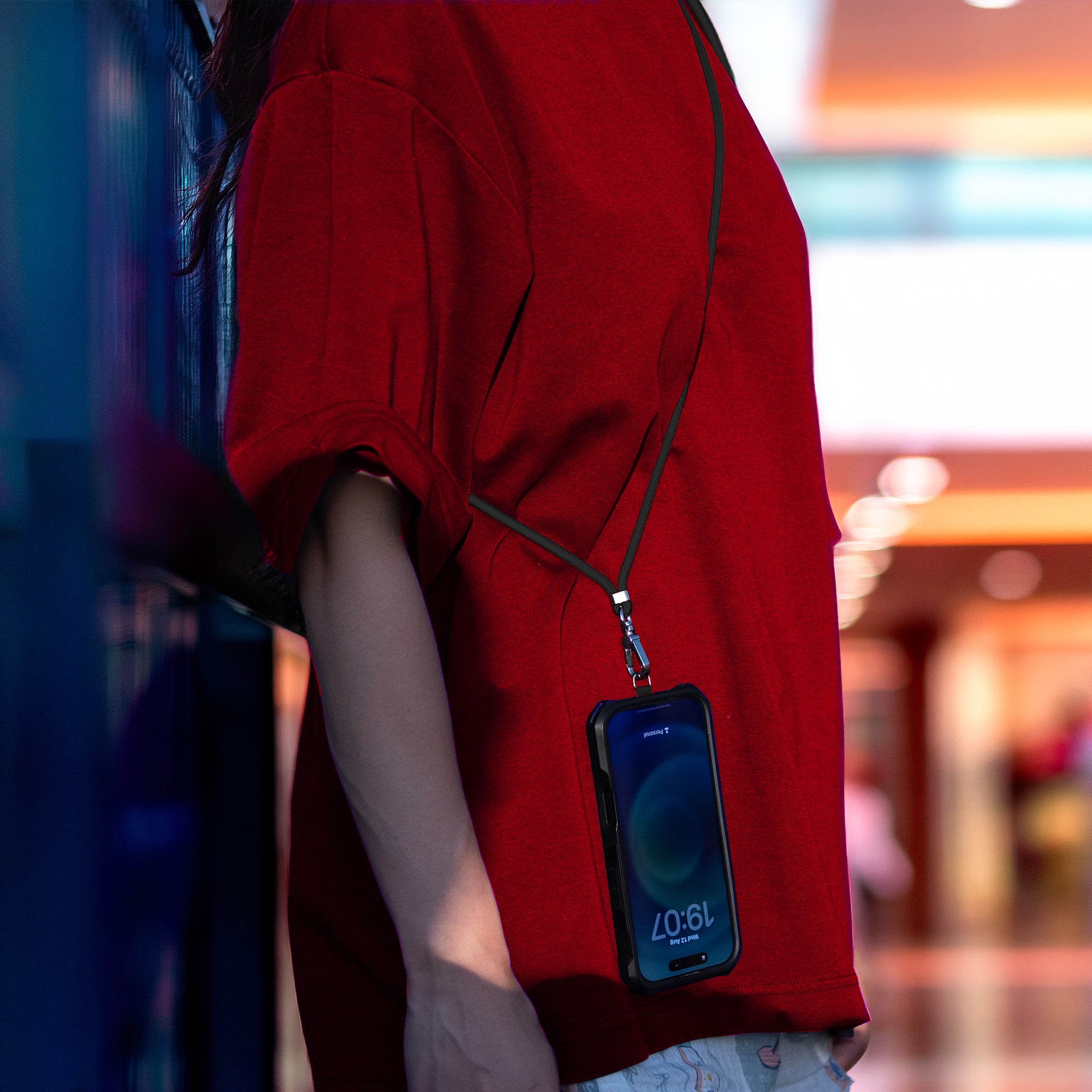 Phone security cable worn across the body to help deter phone snatching